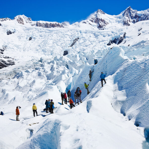 Tourists learning to grapple and rappel on Glacier Grande. Part of the Patagonian South Ice field, Los Glacieres National Park. Santa Cruz Province, Argentina. This is a World Heritage site. The Andes Mountains.